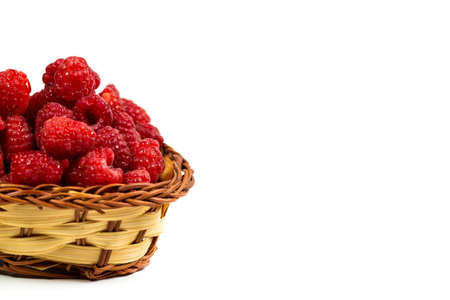 Fresh and red raspberries with vitamins on a white backgroundの写真素材