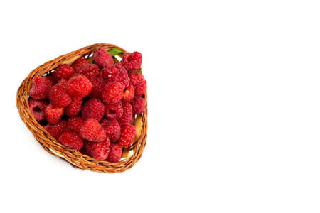 Fresh and red raspberries with vitamins on a white backgroundの写真素材