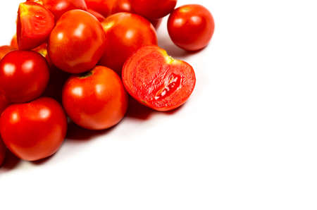 Fresh and red tomatoes on a white backgroundの写真素材