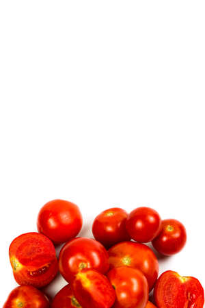 Fresh and red tomatoes on a white backgroundの写真素材