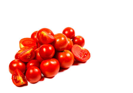 Fresh and red tomatoes on a white backgroundの写真素材