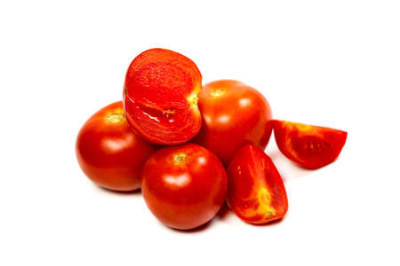 Fresh and red tomatoes on a white backgroundの写真素材