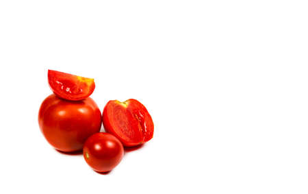 Fresh and red tomatoes on a white backgroundの写真素材