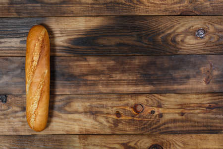 Sliced fresh gluten-free bread on wooden surface