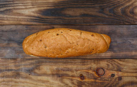 Sliced fresh gluten-free bread on wooden surfaceの写真素材