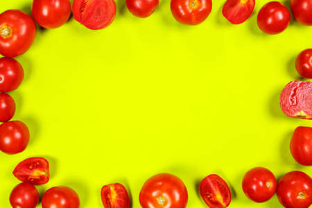 Ripe red tomatoes for salad on a green backgroundの写真素材