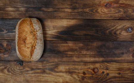 Sliced fresh gluten-free bread on wooden surfaceの写真素材