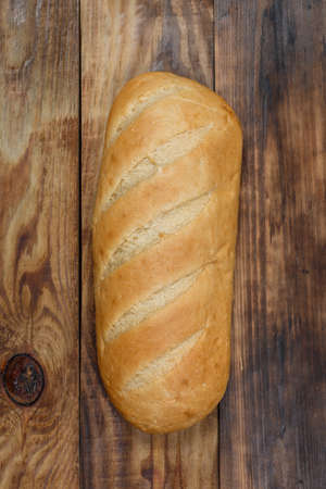 Sliced fresh gluten-free bread on wooden surfaceの写真素材