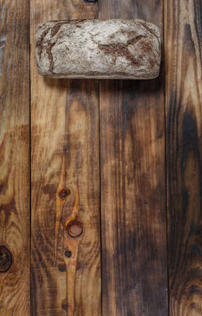 Sliced fresh gluten-free bread on wooden surfaceの写真素材