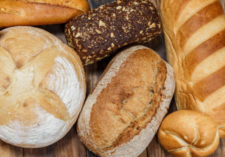 Sliced fresh gluten-free bread on wooden surfaceの写真素材
