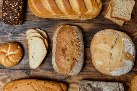 Sliced fresh gluten-free bread on wooden surfaceの写真素材