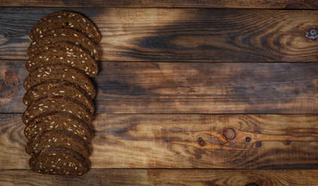 Sliced fresh gluten-free bread on wooden surfaceの写真素材