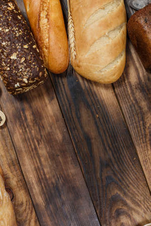 Sliced fresh gluten-free bread on wooden surface