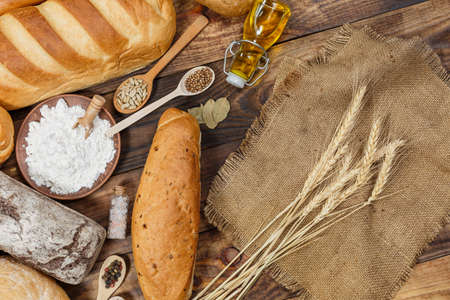 Sliced fresh gluten-free bread on wooden surface