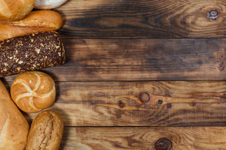 Sliced fresh gluten-free bread on wooden surfaceの写真素材