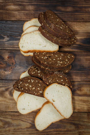 Sliced fresh gluten-free bread on wooden surfaceの写真素材