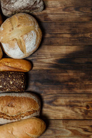 Sliced fresh gluten-free bread on wooden surfaceの写真素材