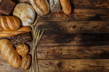 Sliced fresh gluten-free bread on wooden surfaceの写真素材