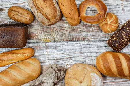 Fresh gluten free bread on a wooden surface in provence styleの写真素材