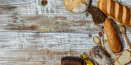 Fresh gluten free bread on a wooden surface in provence styleの写真素材