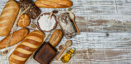 Fresh gluten free bread on a wooden surface in provence styleの写真素材