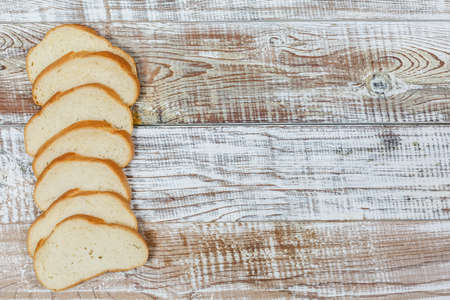 Fresh gluten free bread on a wooden surface in provence styleの写真素材