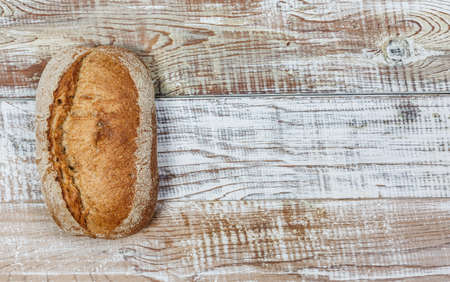 Fresh gluten free bread on a wooden surface in provence styleの写真素材