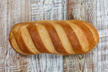 Fresh gluten free bread on a wooden surface in provence styleの写真素材