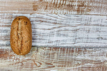 Fresh gluten free bread on a wooden surface in provence styleの写真素材