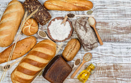 Fresh gluten free bread on a wooden surface in provence styleの写真素材