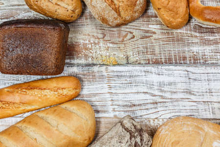 Fresh gluten free bread on a wooden surface in provence styleの写真素材