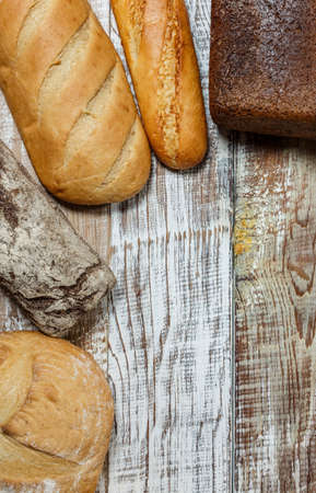 Fresh gluten free bread on a wooden surface in provence styleの写真素材