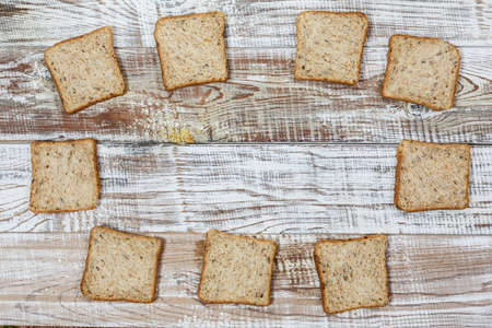 Fresh gluten free bread on a wooden surface in provence styleの写真素材