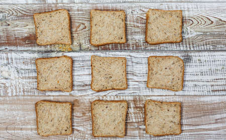 Fresh gluten free bread on a wooden surface in provence styleの写真素材