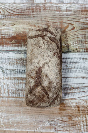 Fresh gluten free bread on a wooden surface in provence styleの写真素材