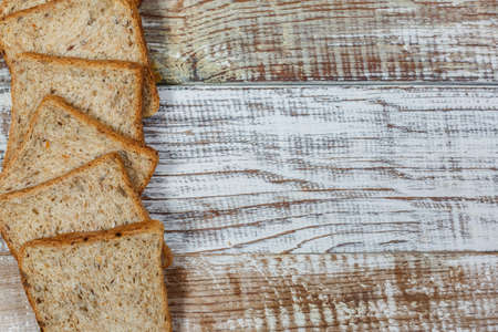 Fresh gluten free bread on a wooden surface in provence styleの写真素材