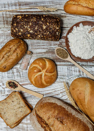 Fresh gluten free bread on a wooden surface in provence styleの写真素材