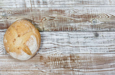 Fresh gluten free bread on a wooden surface in provence styleの写真素材