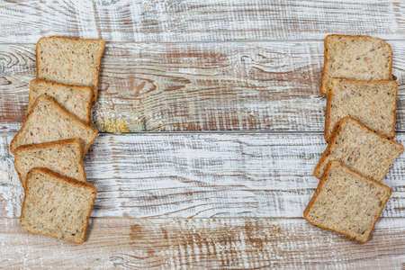 Fresh gluten free bread on a wooden surface in provence styleの写真素材