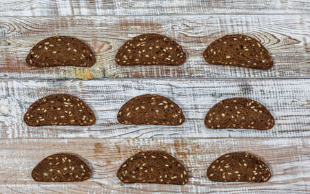 Fresh gluten free bread on a wooden surface in provence styleの写真素材