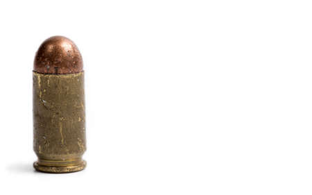Old 9 mm bullet for a pistol, on a white background, closeの写真素材