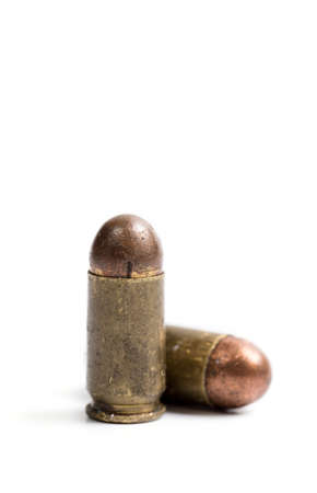 Old 9 mm bullet for a pistol, on a white background, closeの写真素材