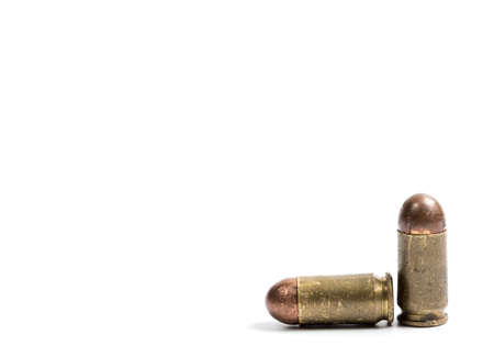 Old 9 mm bullet for a pistol, on a white background, closeの写真素材