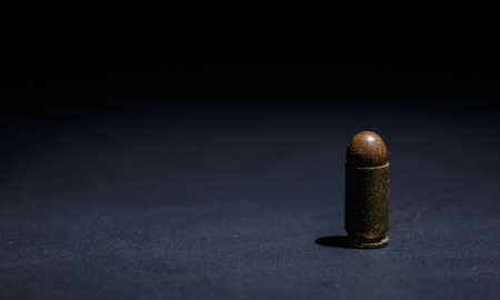 9mm bullet for pistol and self-defense on black backgroundの写真素材
