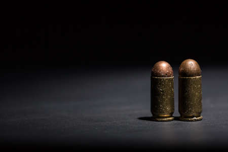 9mm bullet for pistol and self-defense on black backgroundの写真素材