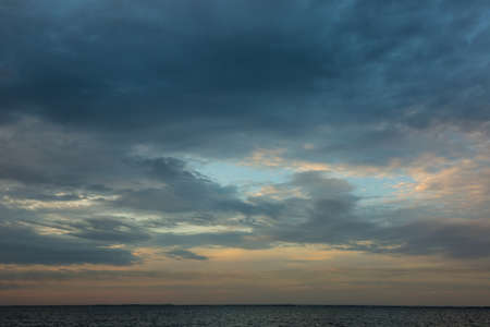Dramatic and romantic sunrise in autumn, clouds and storm cloudsの写真素材