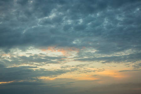 Dramatic and romantic sunrise in autumn, clouds and storm cloudsの写真素材