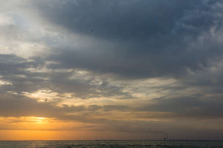 Dramatic and romantic sunrise in autumn, clouds and storm cloudsの写真素材