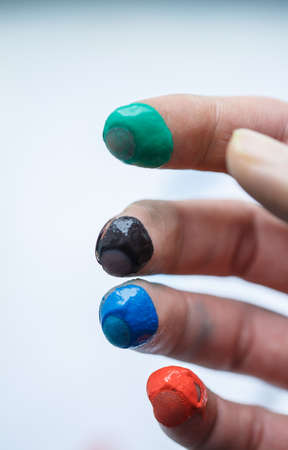Artists hand in different colorsの写真素材