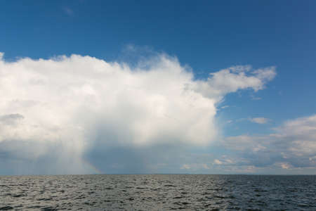 Beautiful white clouds over the river bankの写真素材